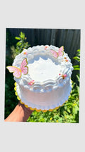 Vanilla cake with flower and butterfly