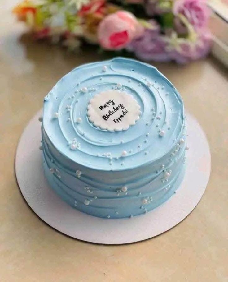 Classic Vanilla  cake with a decorative topper