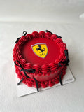 Red cake with Ferrari logo on a white background